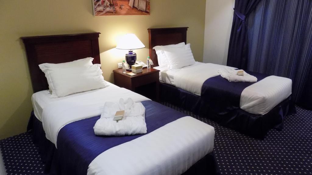 Onizah Hotel Unaizah Szoba fotó